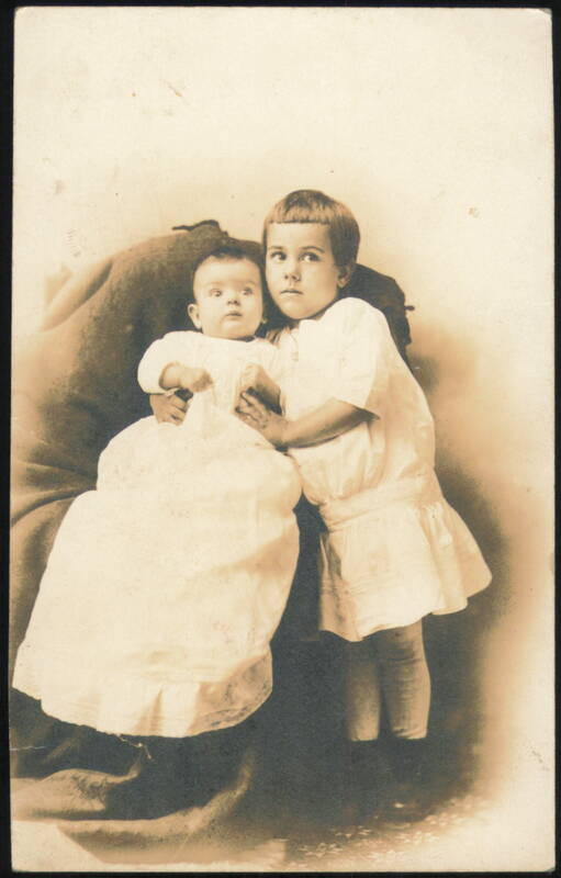 Two Children, Older Child Embracing Baby Latrobe Pennsylvania