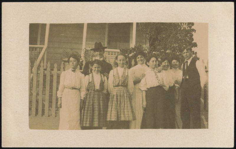 Group Portrait of 10 People in Front of House Family Portaits