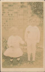 Children Holding Hands, Brick Wall Background Postcard