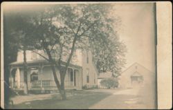 Two-Story House with Wrap-Around Porch and Barn Postcard