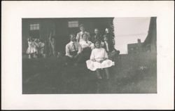 Group of People in Front of House Postcard