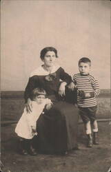 Woman with Two Children Portrait Postcard