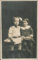 Two Young Girls Sitting Together Postcard