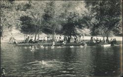 People Swimming and Relaxing by a River Postcard