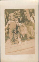 Smiling Child in Overalls with Large Dog Postcard