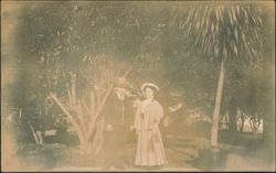 Man and Woman Posing Outdoors with Palm Tree Postcard