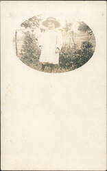 Young Child in Hat and Coat, Man in Background Postcard
