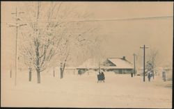 Snowy Village Street with Horse-Drawn Sleigh Postcard