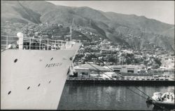 Ship Patricia in Harbor with Hillside City Postcard