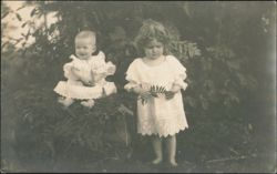 Two Children in White Dresses Outdoors Postcard