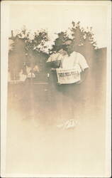 Men Holding Newspaper, Yanks 4 Miles from Fisvies Postcard