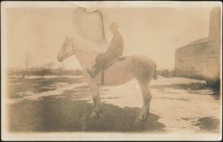Man on Horseback in Snowy Field with Barn Postcard