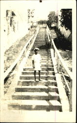 Boy on Stairs Postcard