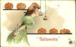 Woman Bobbing Apples Halloween Postcard Postcard