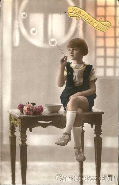 A young girl blows bubbles Girls