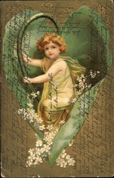A cherubic child wrapped in a large leaf with flowers A cherubic child wrapped in a large leaf with flowers