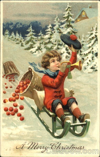 Young boy sledding at Christmas Children