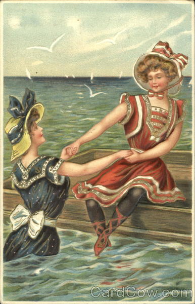 Two young women at the beach Swimsuits & Pinup