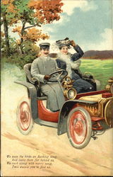 Man and woman in an antique car Postcard