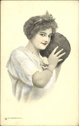 Woman holding a medicine ball Postcard