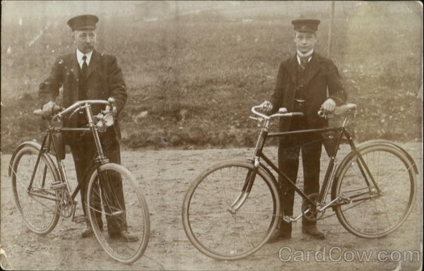 Man & Boy with Bicycles (Postmen?)