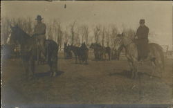 Men herding horses in corral Men herding horses in corral