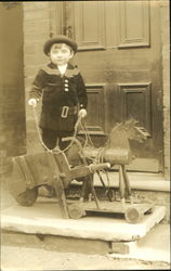 Boy with Toy Horse Postcard