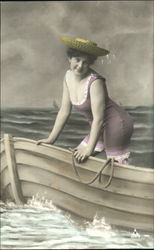 Woman wearing bathing suit in rowboat Postcard