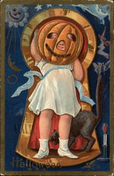 A little girl wearing a pumpkin mask Postcard