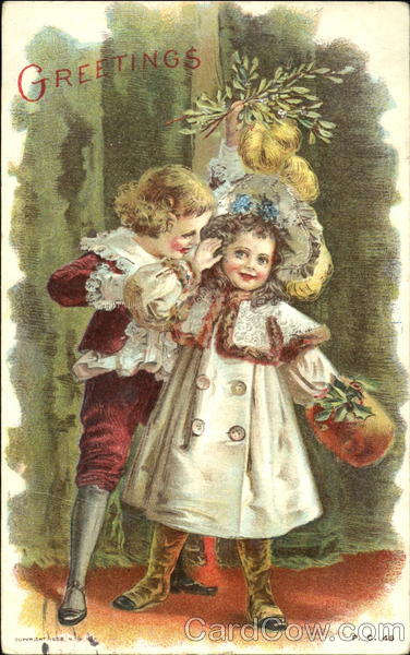 Boy and girl under mistletoe Children