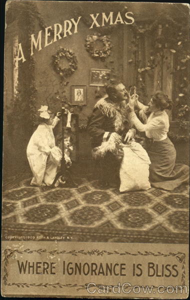 Women helping man dress as Santa while little children walk in the room