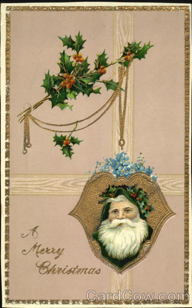 Santa wearing green on ornament hanging from Holly leaves