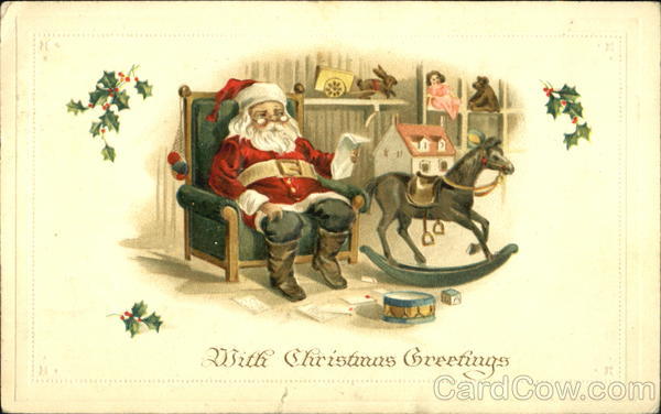 santa sitting green chair reading letter toys all around