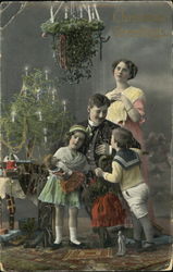 A victorian Family on Christmas day Postcard