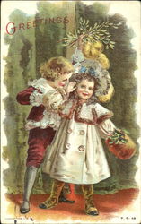 Boy and girl under mistletoe Postcard