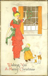 Art Deco woman hanging wreath with child and dog Postcard