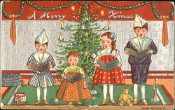 Well dressed children with greeting cards before christamas tree Postcard