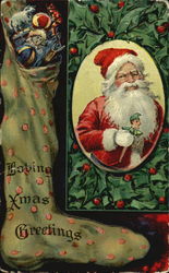 Stocking filled with toys , Santa holding toy surrounded by holly Postcard