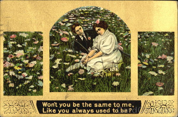 Couple seated in a field of flowers Couples