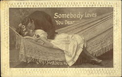 Man kissing a woman in a hammock Postcard