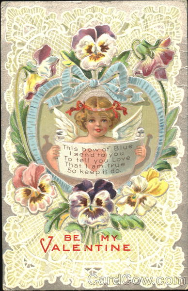 Cupid in heart of blue ribbon with pansies
