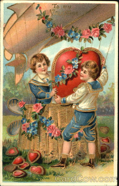 Two boys getting a heart out of a basket Children