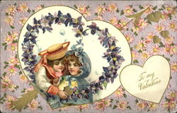 Child couple enclosed in heart of violets Postcard
