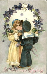 A boy kissing a girl surrounded by flowers Postcard