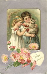 Two girls holding striped cat Postcard