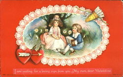 Boy with accordian, girl with straw hat, circled with lacy hearts Postcard