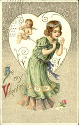cupid, girl in green dress looking down at card and flower Postcard