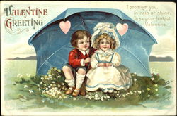 Young boy and girl sitting on lawn under large black umbrella Postcard