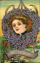 Elegant woman's head in heart made of blue flowers Elegant woman's head in heart made of blue flowers