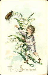 Boy in white sailor suit, white flowers, beetle Postcard